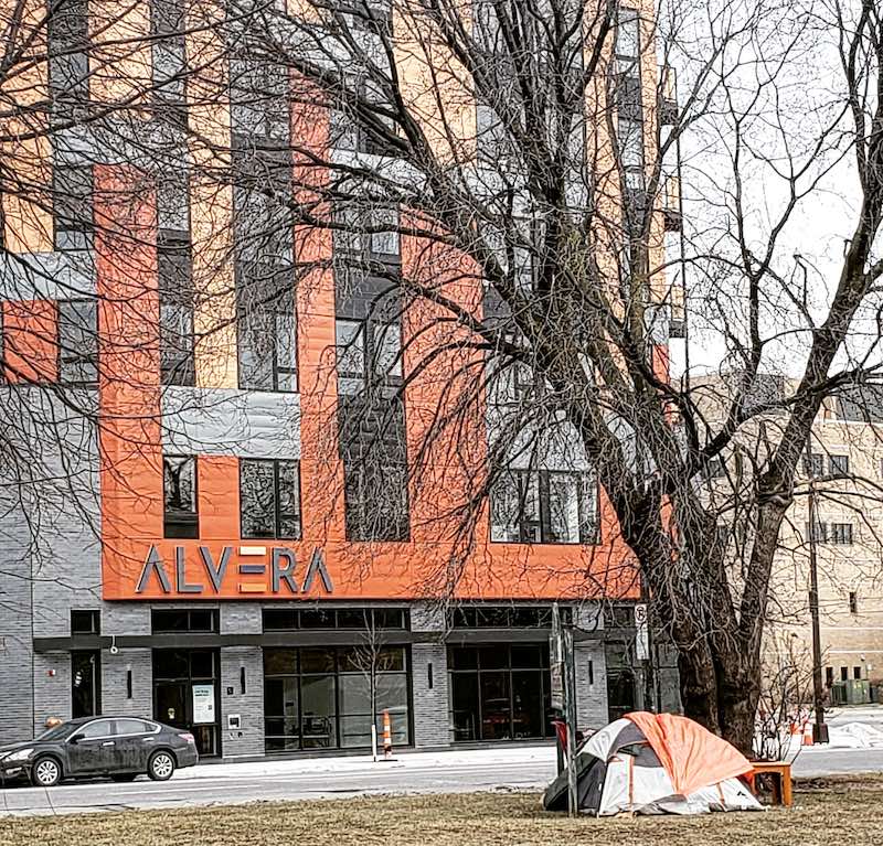 apartment building and tent